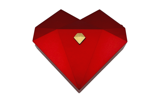 Three heart-shaped ring gift boxes in white, green, and red, with gold accents, displayed in an open presentation box.