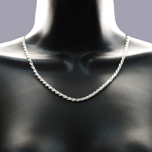 Silver rope chain necklace on a mannequin neck against a dark background