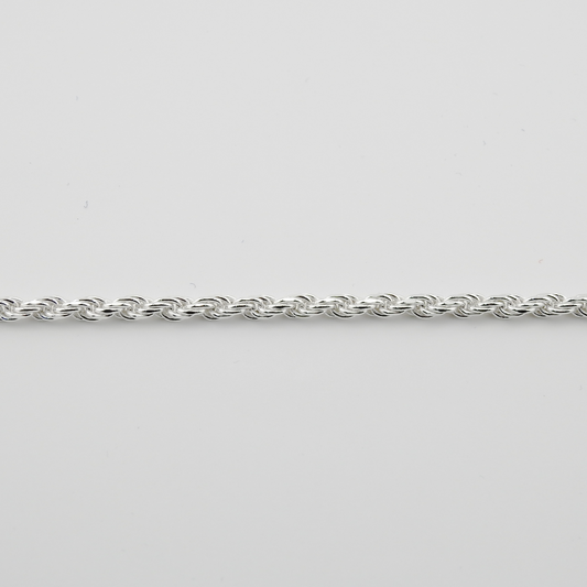 Silver chain on a light gray background