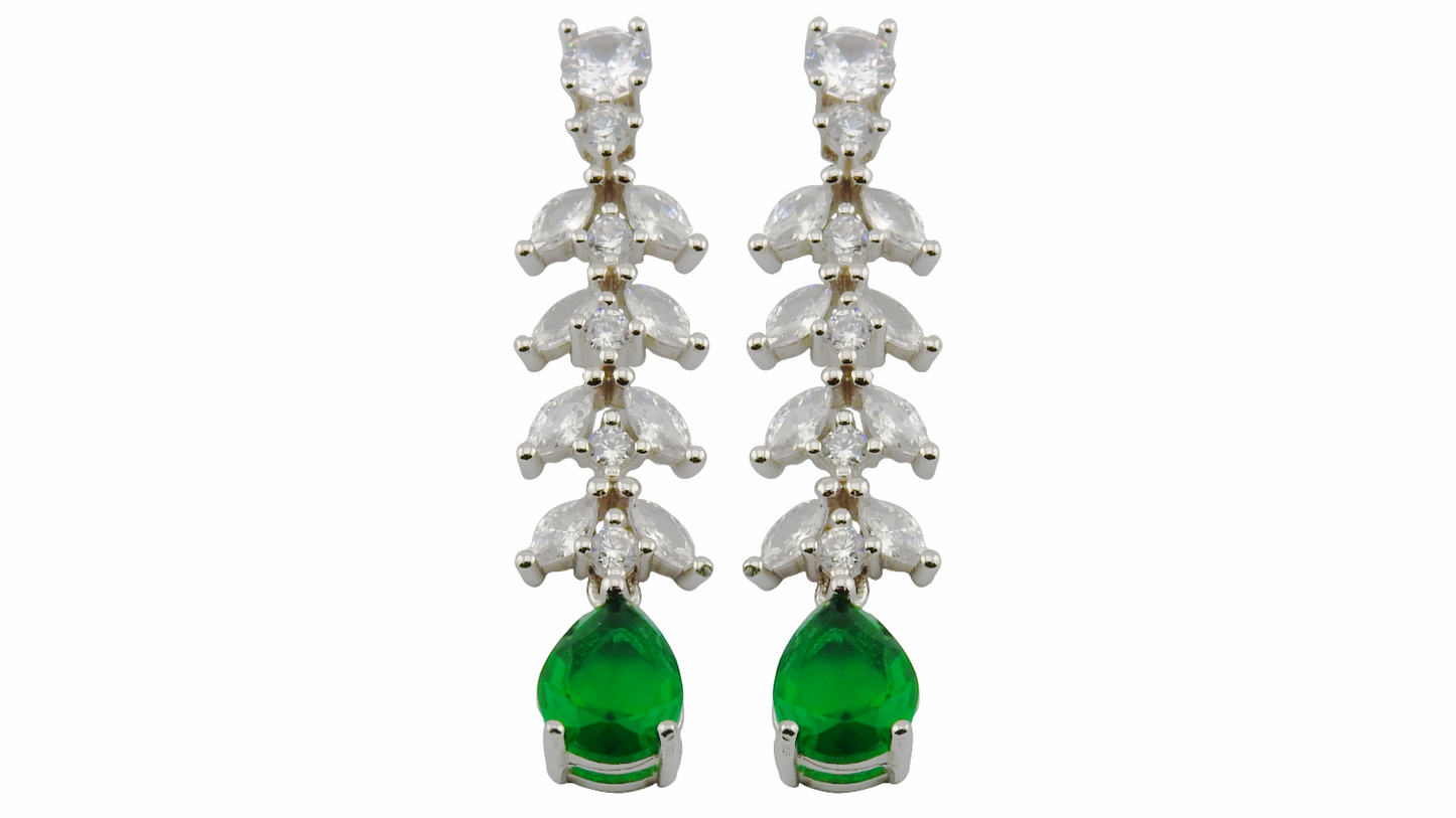 Pair of earrings with green gemstones and white stones on a white background