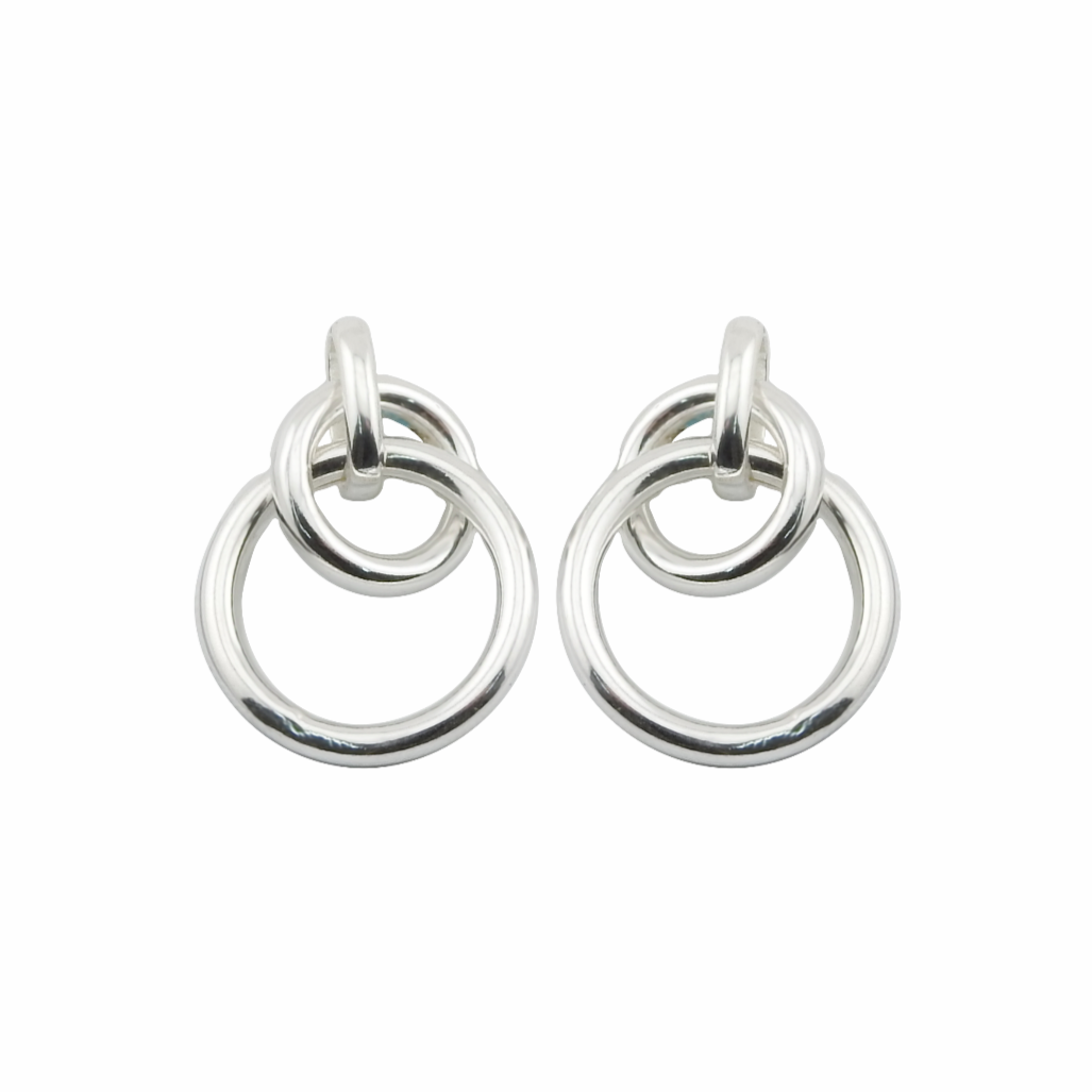 Pair of silver hoop earrings on a white background