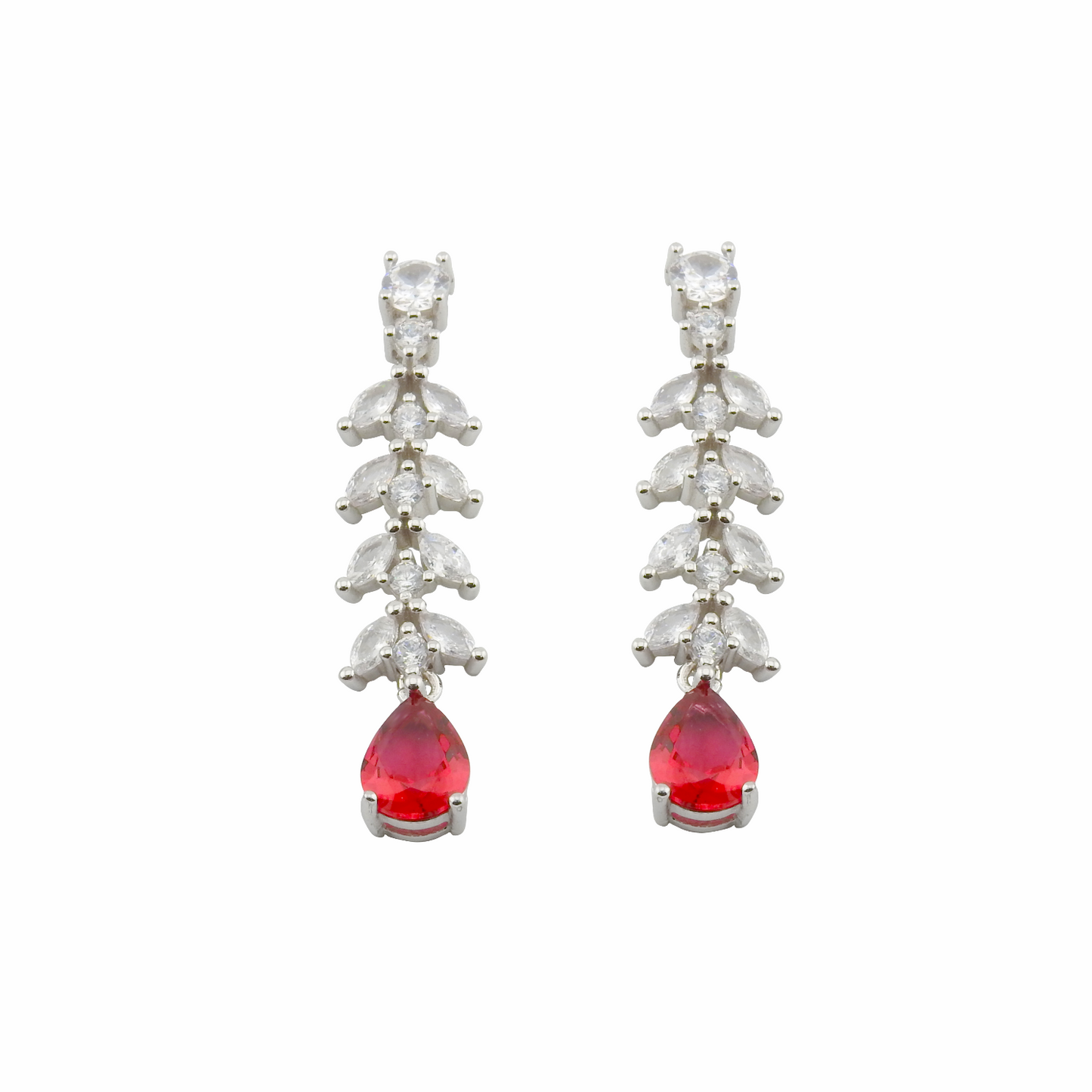 Pair of earrings with red teardrop stones and silver accents on a white background