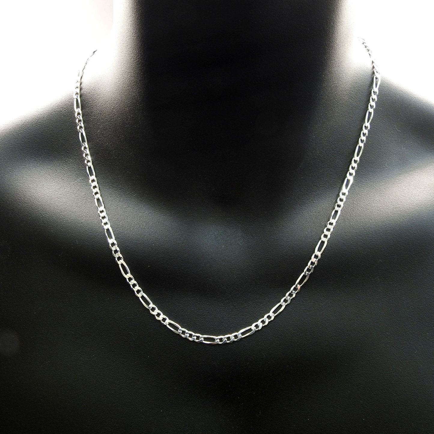 Silver chain necklace on a black mannequin