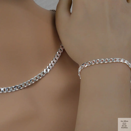 Silver curb chain necklace and bracelet on a mannequin