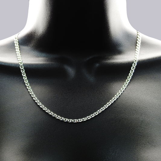 Silver chain necklace on a mannequin neck against a dark background