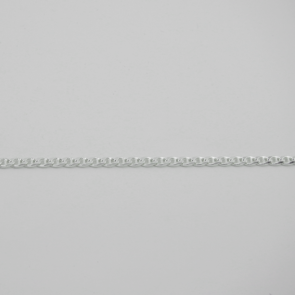 Silver chain on a light gray background