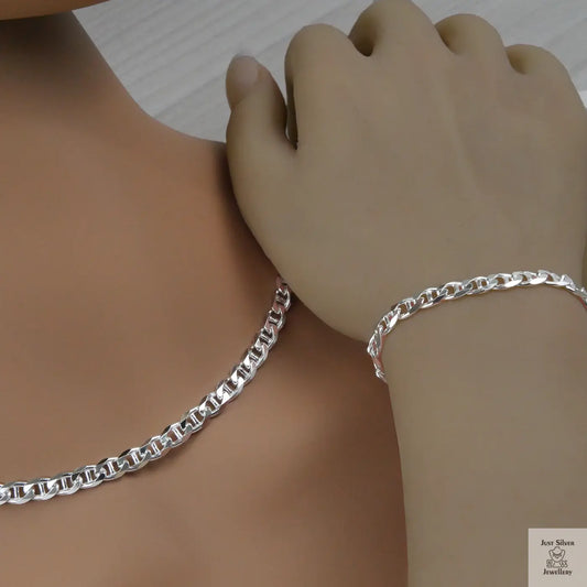 Silver marina chain necklace and bracelet on a mannequin and hand