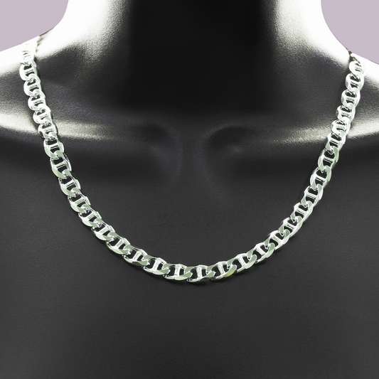 Silver chain necklace on a mannequin neck against a dark background