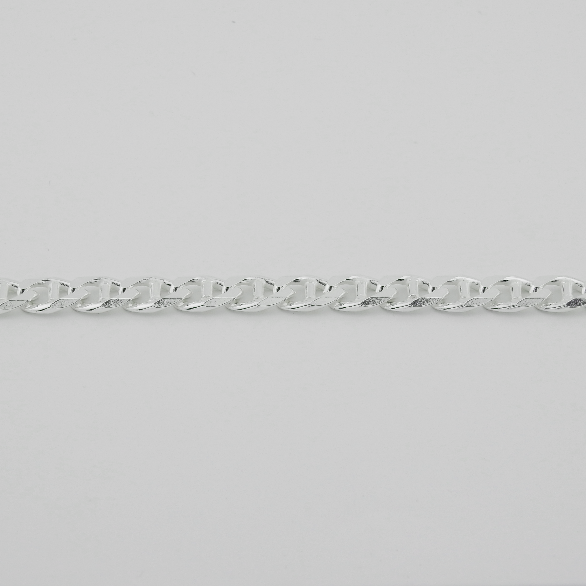 Silver chain on a light gray background