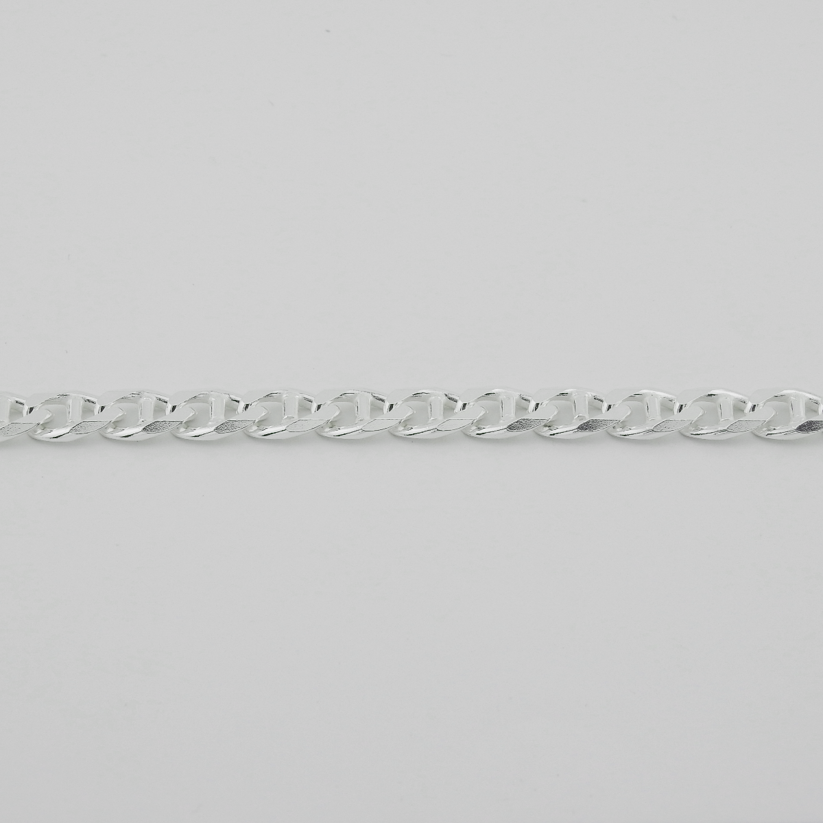 Silver chain on a light gray background