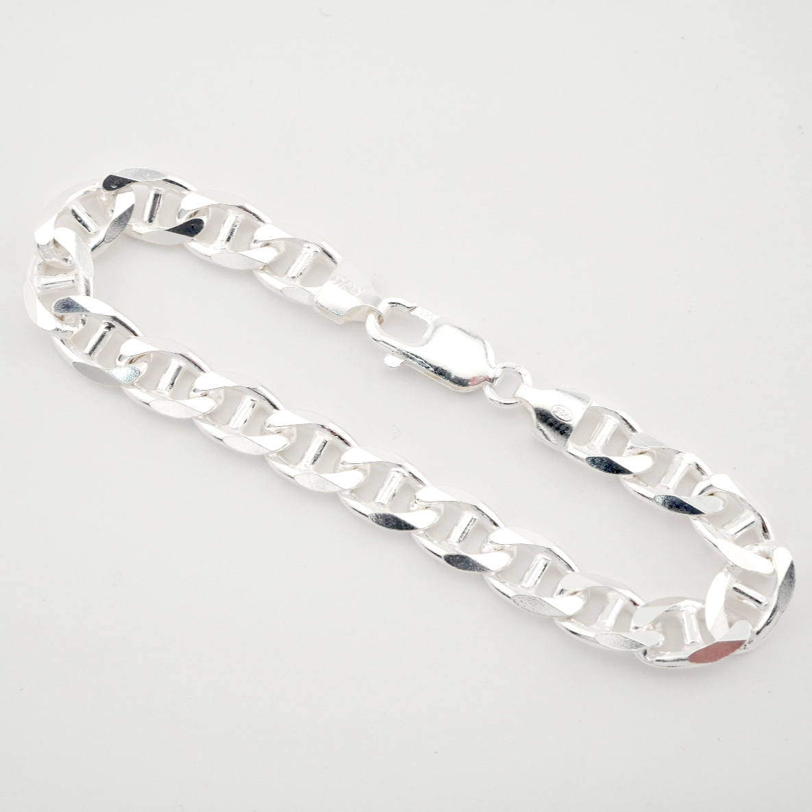 Silver chain bracelet on a white background