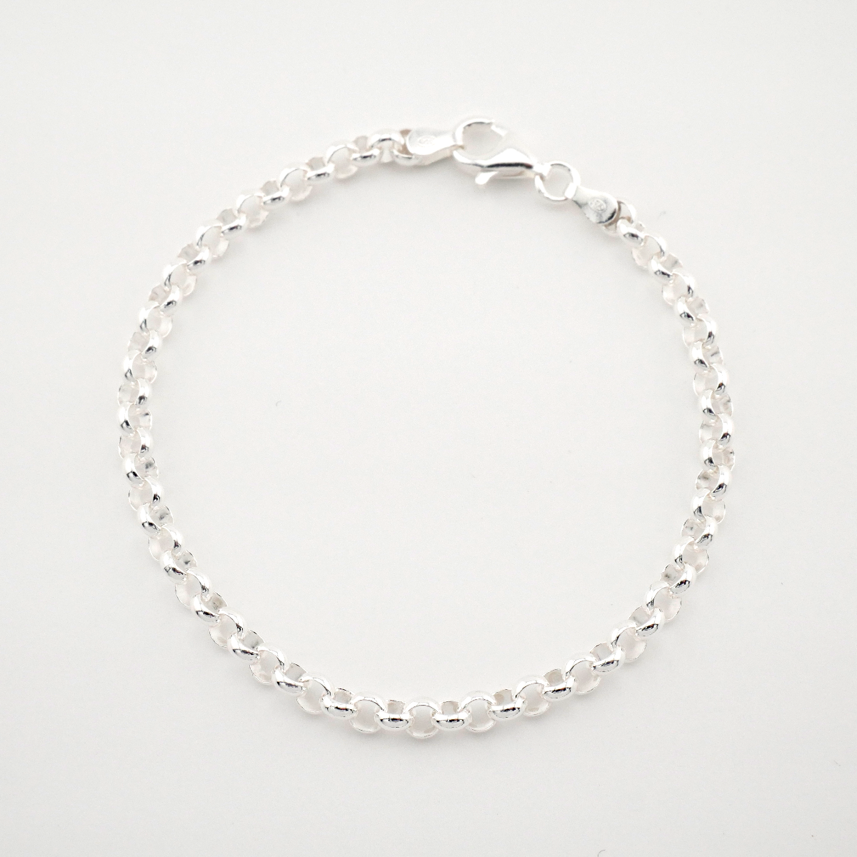 Silver beaded bracelet on a light gray background