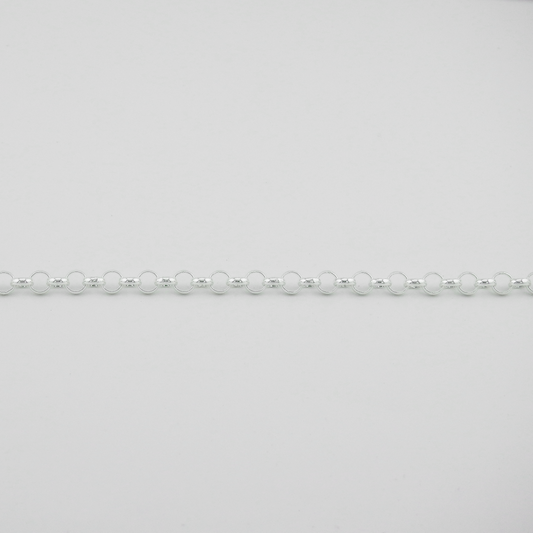 Silver beaded necklace on a light gray background