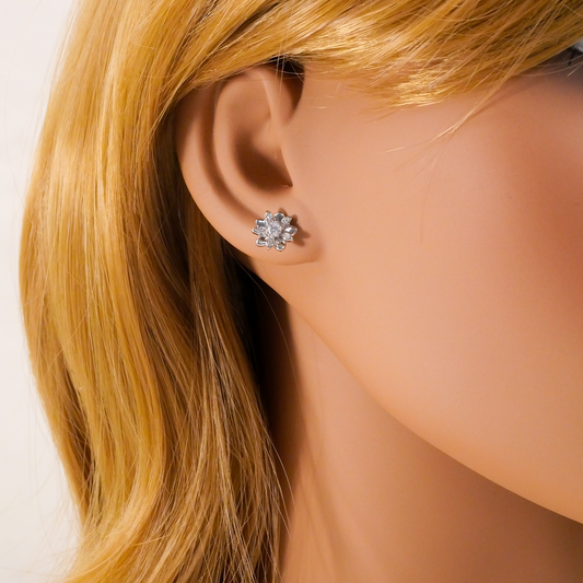 Close-up of a person wearing natural zircon stud earrings with blonde hair.