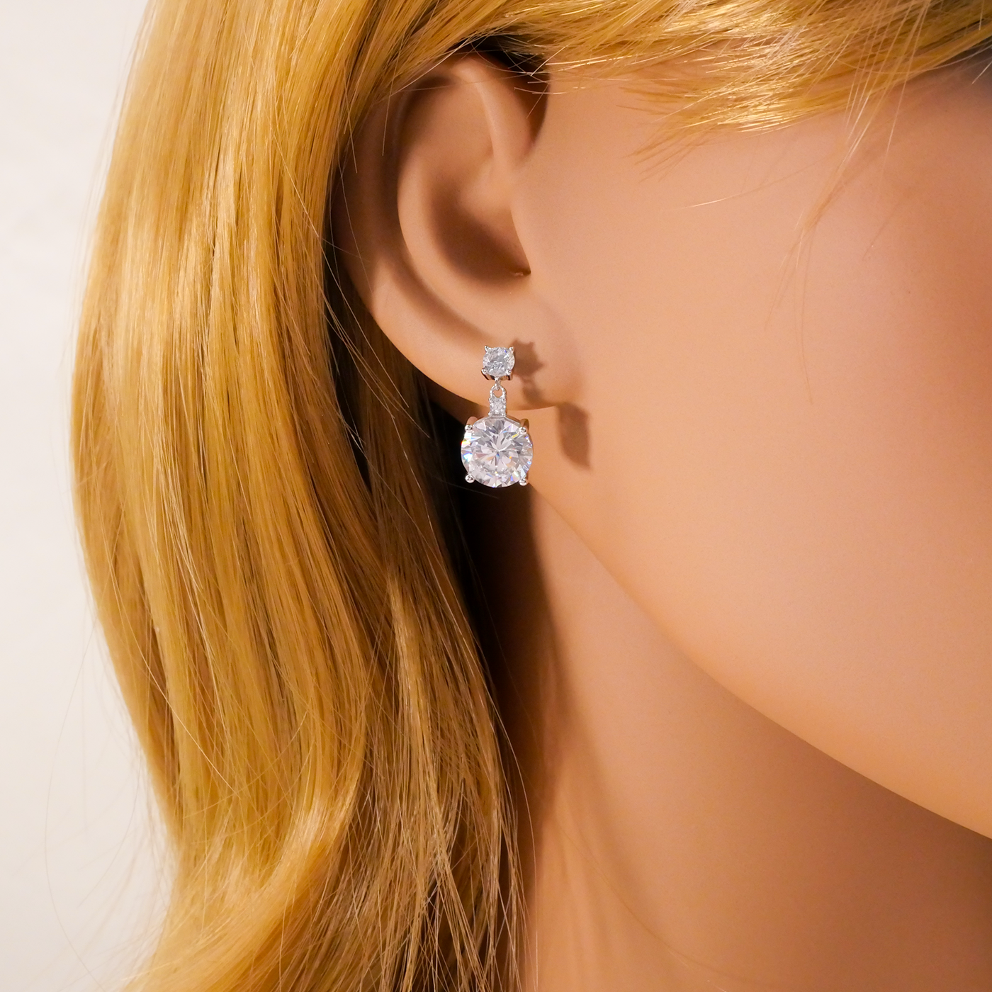 Close-up of a person wearing Natural Zircon earrings with blonde hair.