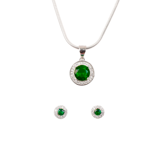 Jewelry set with pendant and earrings featuring green gemstones on a white background