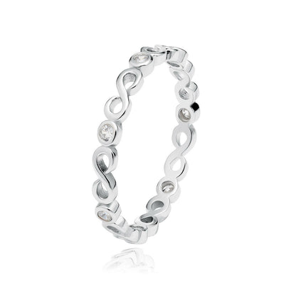 Silver ring with intricate design on a white background