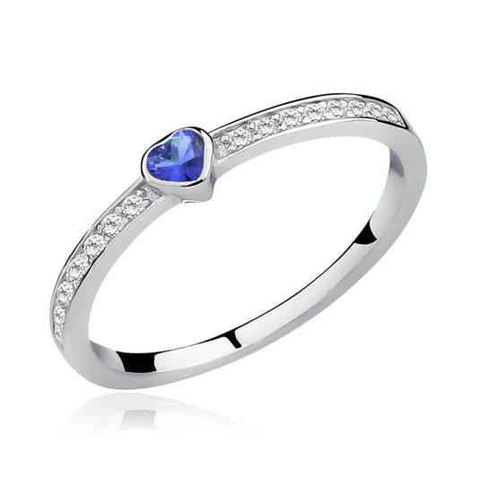 Silver ring with a heart-shaped blue gemstone on a white background