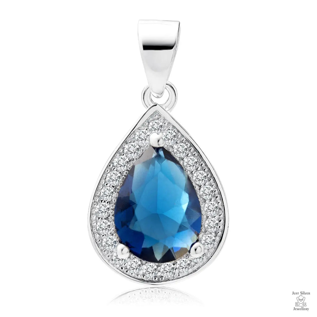 A silver teardrop-shaped pendant with a central blue sapphire gemstone surrounded by white zirconia