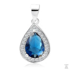 A silver teardrop-shaped pendant with a central blue sapphire gemstone surrounded by white zirconia