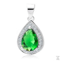 A silver pendant with a teardrop-shaped central emerald gemstone surrounded by white zirconia