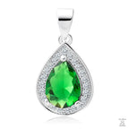 A silver pendant with a teardrop-shaped central emerald gemstone surrounded by white zirconia