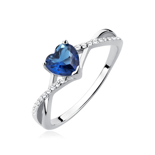 A sterling silver heart ring with a sapphire zirconia centerpiece and sparkling zirconia cascading down the shank.