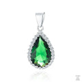 A silver pendant with a pear-shaped emerald zirconia centerpiece surrounded by white zirconia stones.