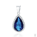 A silver pendant with a pear-cut blue sapphire zirconia in the center, surrounded by white zirconia gems.