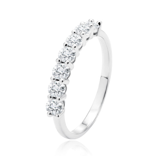 A silver eternity ring with multiple white zirconia stones set in a row.