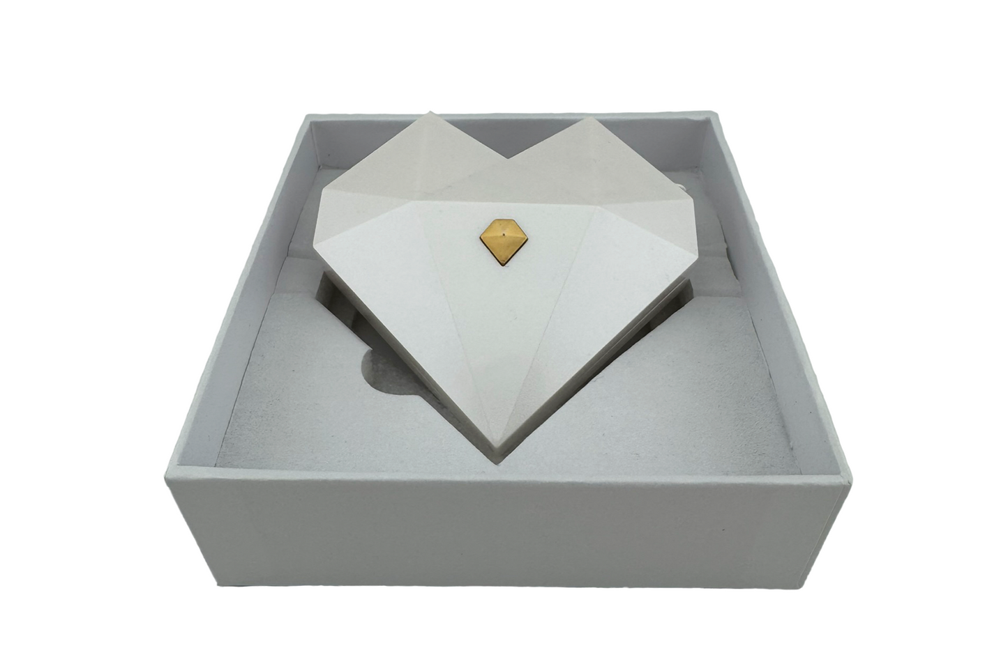 Three heart-shaped ring gift boxes in white, green, and red, with gold accents, displayed in an open presentation box.