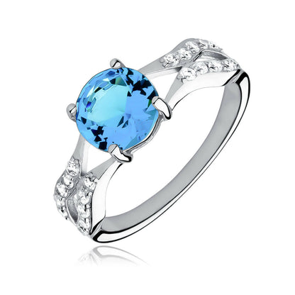 Silver ring with a blue gemstone on a white background