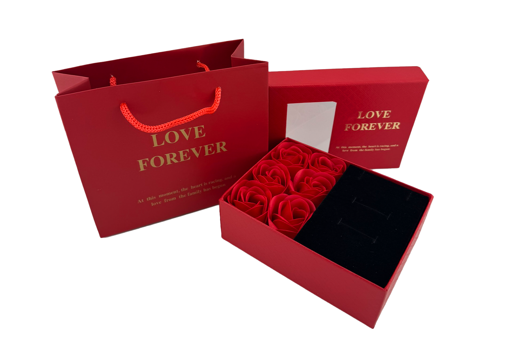 A red jewellery box with a gift arrangement of six roses, accompanied by a matching presentation bag with the text 'LOVE FOREVER' printed on it.