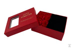 A red jewellery box with a gift arrangement of six roses, accompanied by a matching presentation bag with the text 'LOVE FOREVER' printed on it.