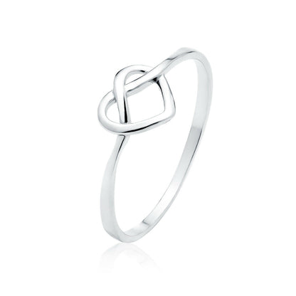 Silver ring with a knot design on a white background