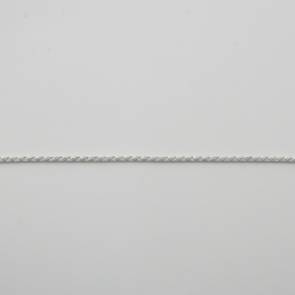 Silver chain on a light gray background