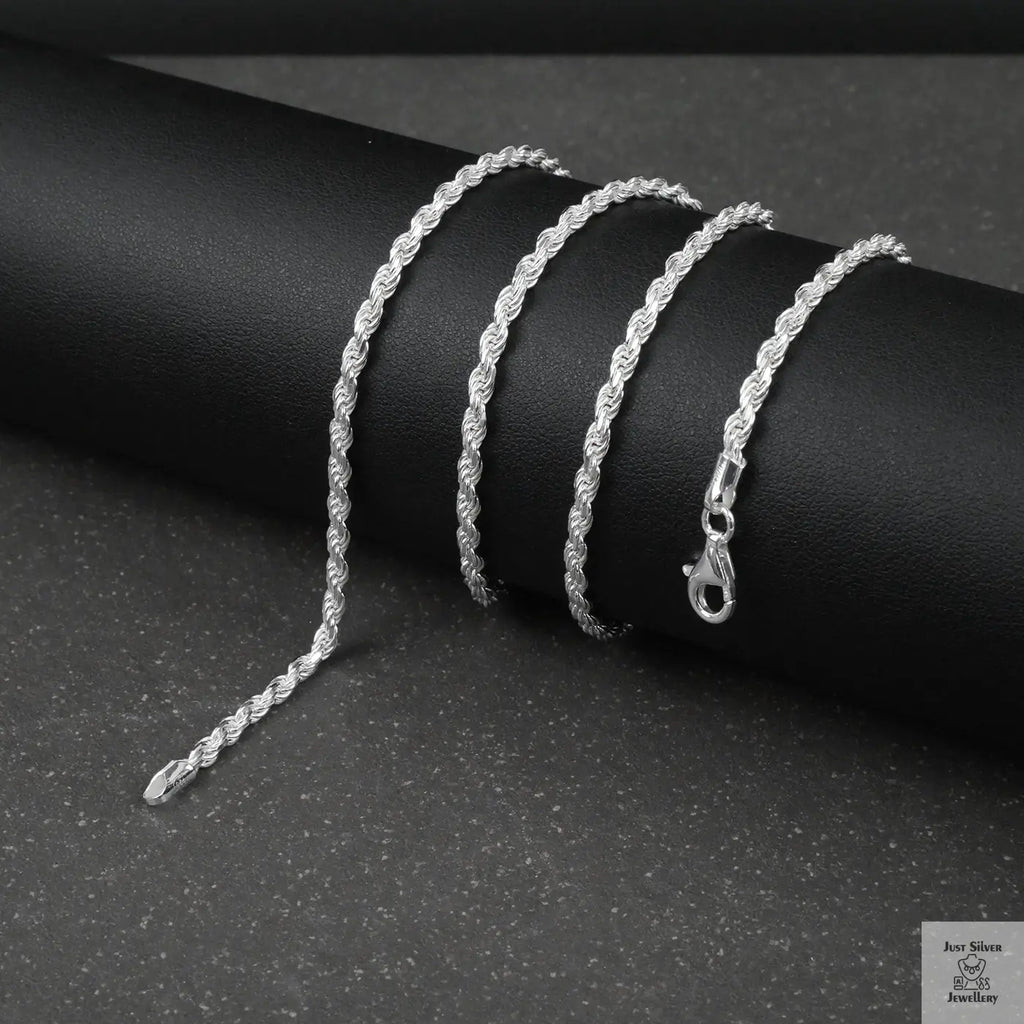 Silver rope chain on a dark surface