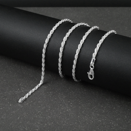 Silver rope chain on a dark surface