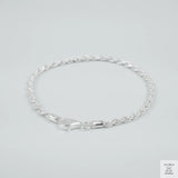 Silver rope bracelet on a light grey background