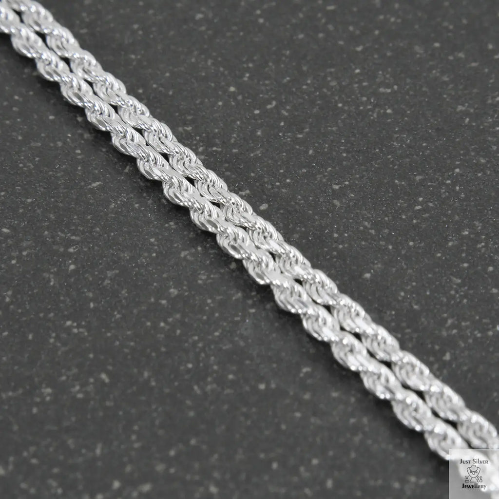 Silver chain on a light gray background