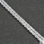 Silver chain on a light gray background