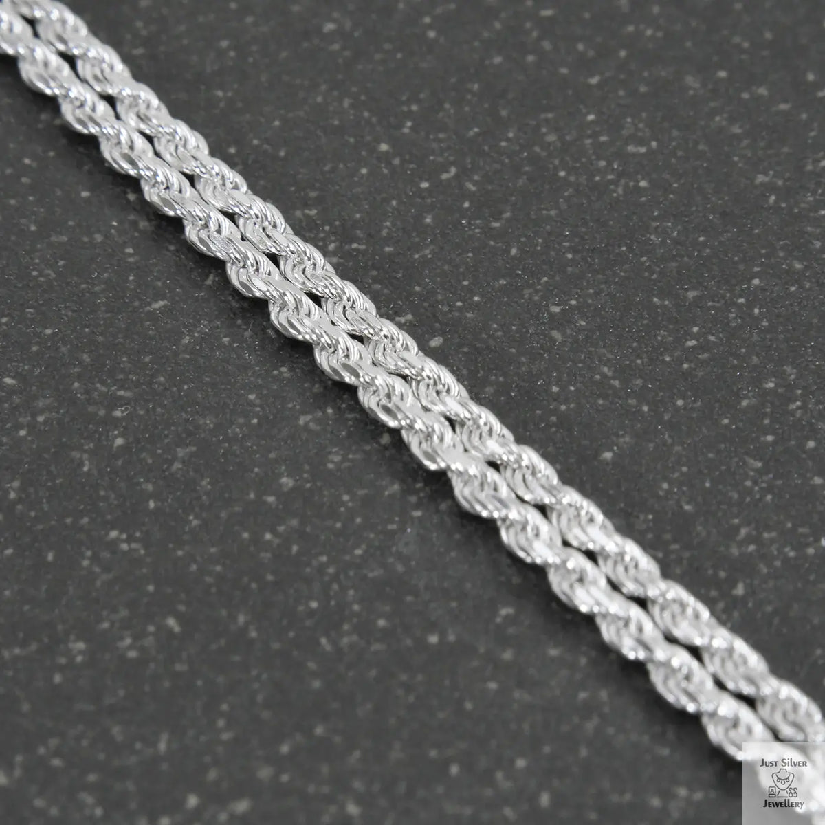 Silver chain on a light gray background