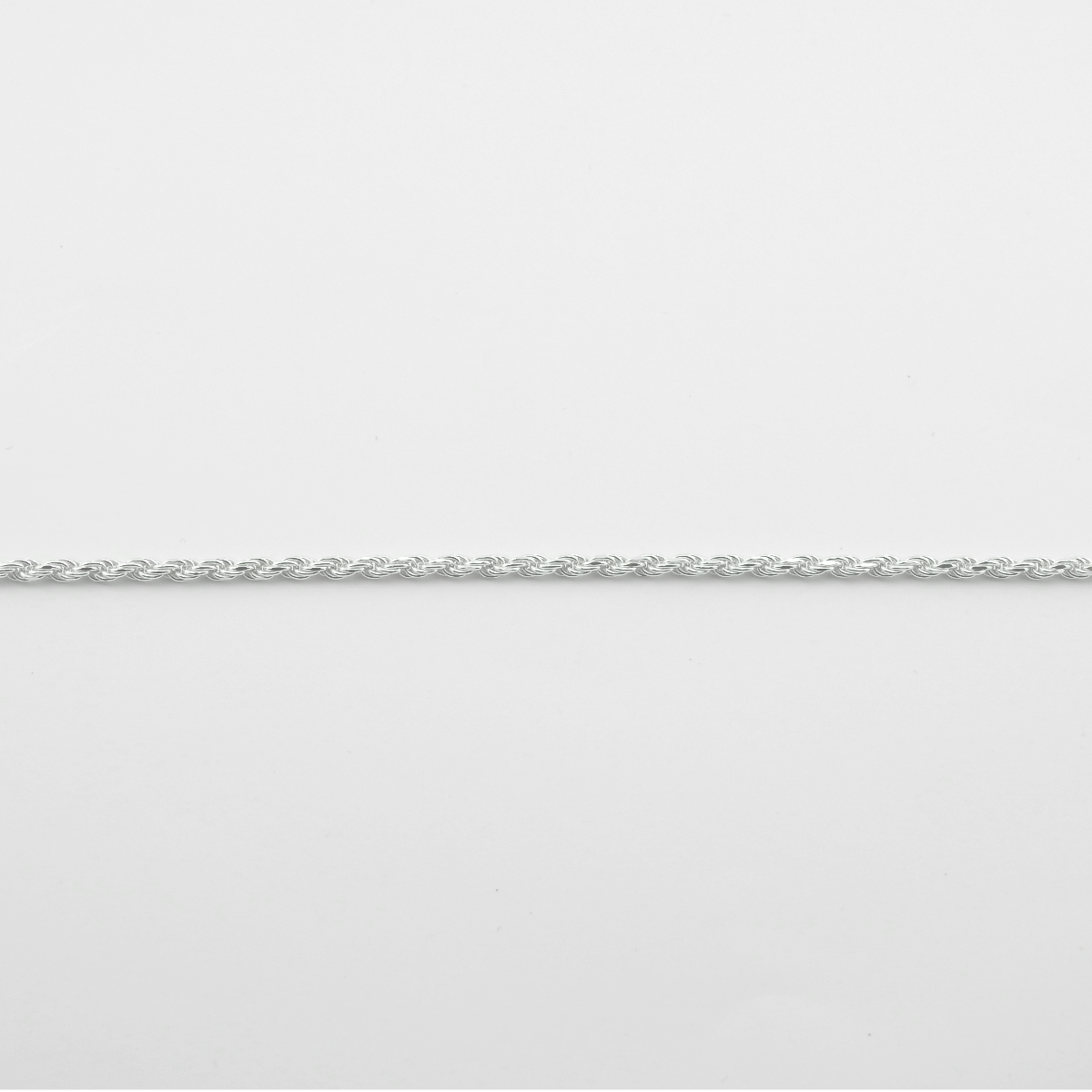 Silver chain on a light gray background