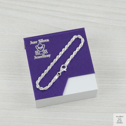 Silver rope bracelet on a purple and white box with 'Just Silver' branding.