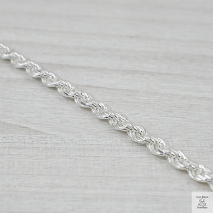 Silver chain on a light grey background