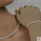 Silver rope chain necklace and bracelet on a mannequin and hand