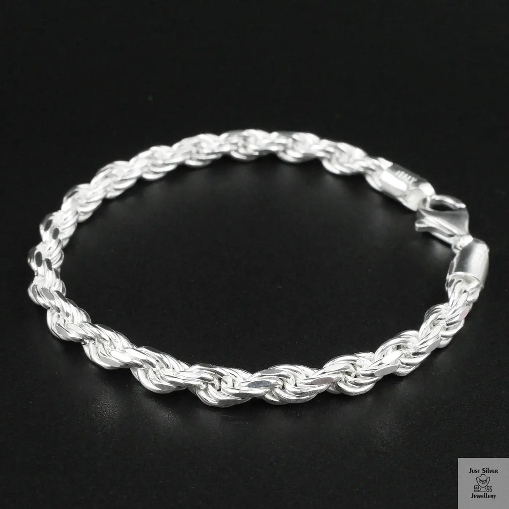 Silver rope bracelet on a black background
