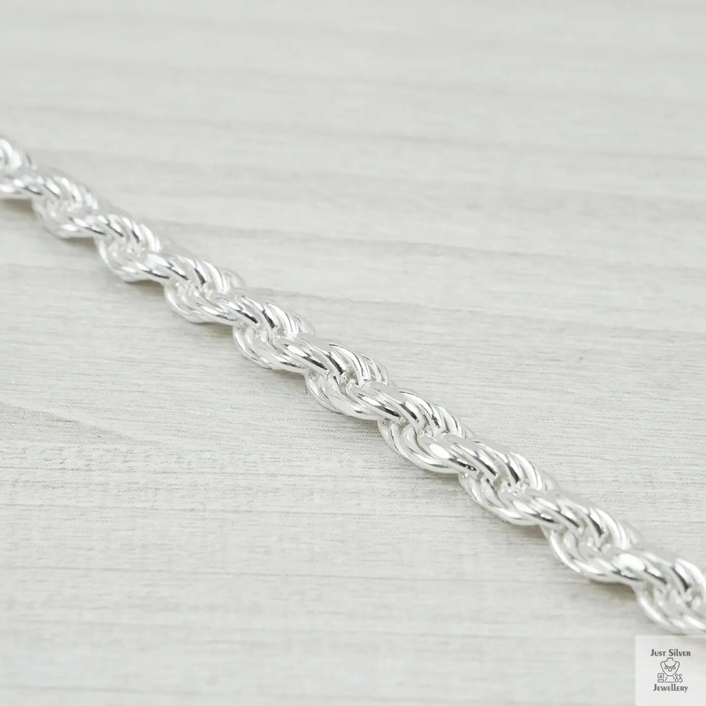 Silver chain on a light grey background