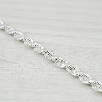 Silver chain on a light grey background