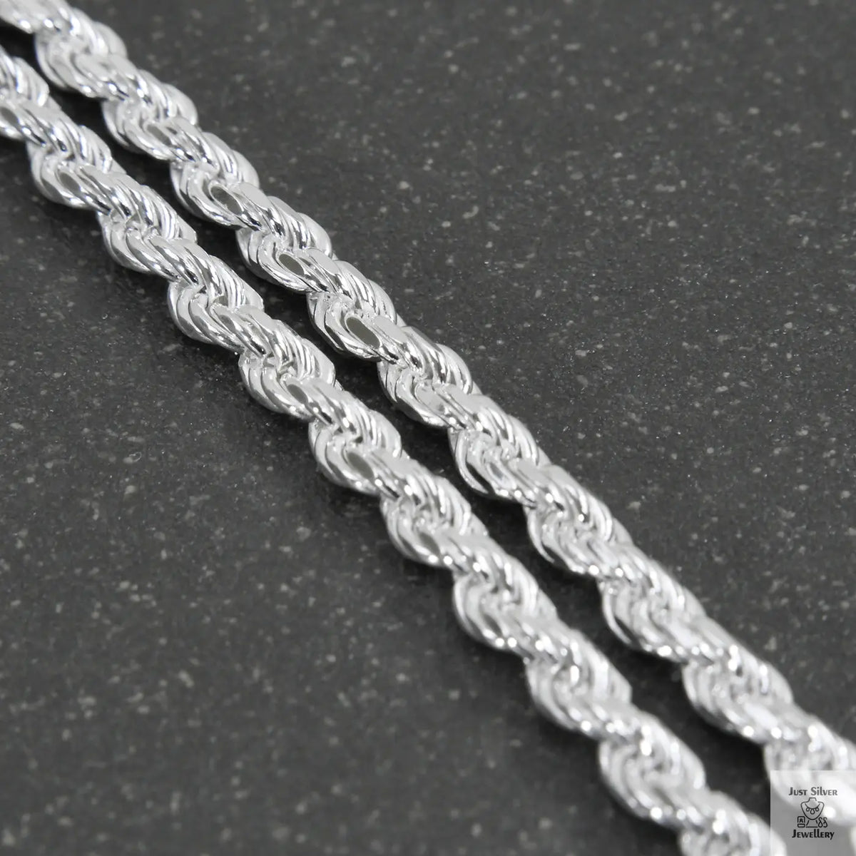 Silver chain on a light gray background